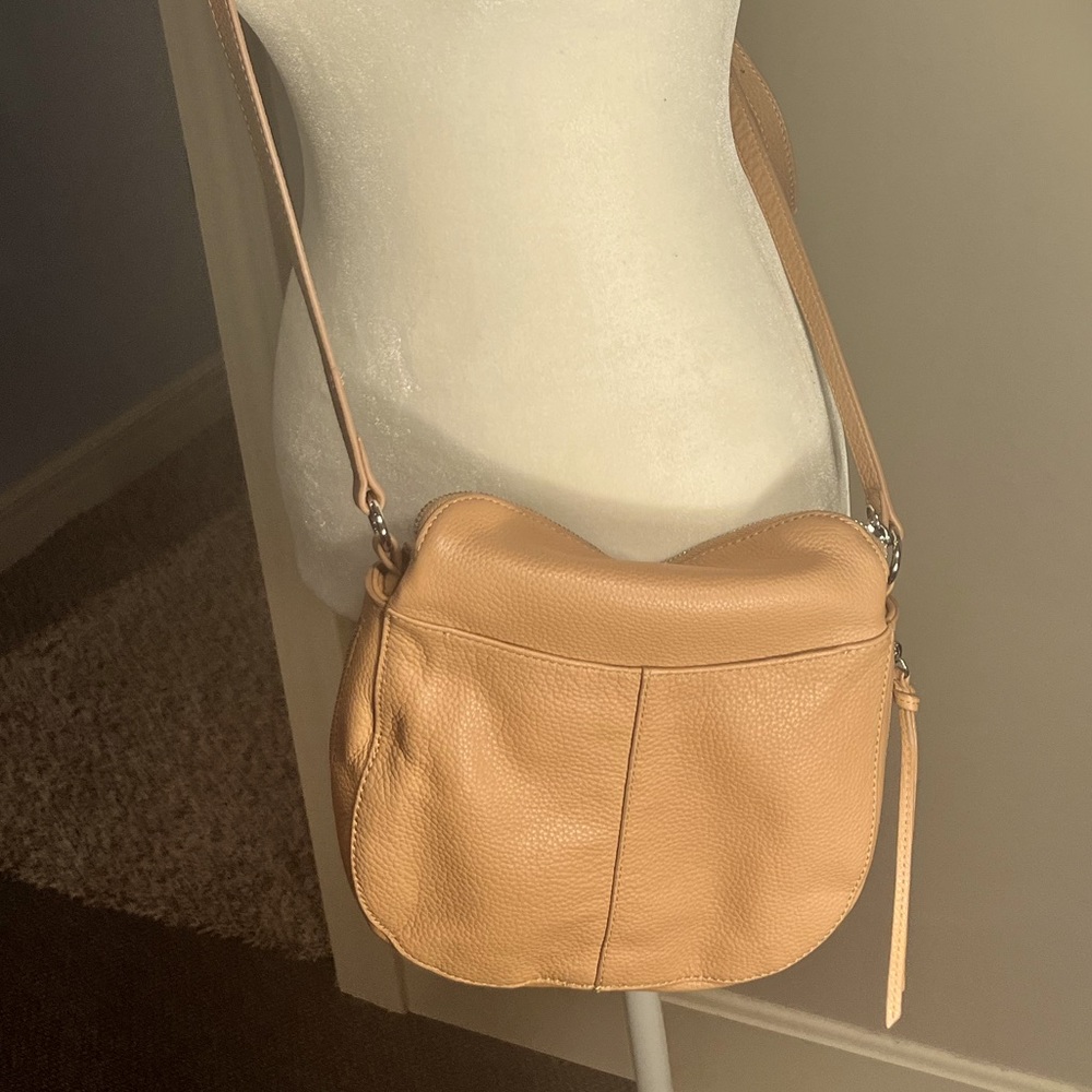 Cream Vince Camuto purse. Expandable with lots of pockets.